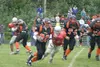 West running back Montel Massenberg avoids a James Marquis
tackle on a 51-yard scoring run during the second quarter of the
Eagles' 31-0 loss to Wasilla on Saturday. Photo by JEREMIAH BARTZ/

