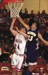 Travis Webb puts up a shot just past the reach of a Malemute
defender in the fourth quarter of Wednesday's game at Wasilla High
School. Photo by TIM BRODT/Frontiersman.