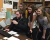 WHS Spanish teacher Timothy Hall shows (left to right) juniors Kaitlyn Dykman, Caitlyn Hacker, and Rachel Outterson the sightseeing in Spain students can look forward to on their upcoming spr