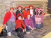 Members of the Red Hot Hooters of the Red Hat Society enjoyed
the fair as a group. From left on the floor are SueAnn Roesing,
Janet Jacob and Cathy Hart. Seated on the hearth are, from left,
