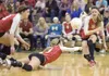 Wasilla's kayla Bell, center, dives for the ball as Leah Taylor,
left, and Haley Taylor, right, back her up during a recent game
against Palmer at Wasilla High School. (ROBERT
DeBERRY/Frontie