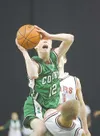 ROBERT DeBERRY/Frontiersman Colony junior John Palmer drives to
the basket during the first half of Friday’s semifinal game at the
state basketball championship tournament in Anchorage.