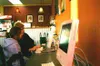 Annette Andres surfs the Internet with her daughter, Markie
Andres, at the new Valley MacStore and iCafe. JOEL
DAVIDSON/Frontiersman