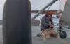 With valley winds gusting over 50 mph, William Frantz, Meadow Lakes, ties down his 1969 Champion Explorer at the Wasilla Airport during Saturday's high winds. Frantz commented that he thought