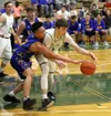 Colony freshman Patrick McMahon works to keep the ball away from Kodiak point guard Roberto Giron during a win over the Bears Friday, Jan. 19, 2018. Courtesy of Bruce Eggleston/matsusports.ne