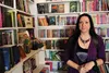 Black Birch Books owner Taylor Jordan amid her mounds of books, covering all genres. She also has a special section dedicated to children. Frontiersman file photo.