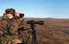 Howard Delo glasses for caribou at a point overlooking the
Sagavanirktok (Sag) River. Wildlife, including musk ox, trumpeter
swans, caribou and bear can be seen on the road to the North Slope
