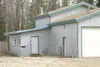 MATT TUNSETH/Frontiersman Alaska State Troopers, along with
Wasilla and Palmer police, raided this house on Merciful Circle,
off Bogard Road near Wasilla, early Saturday morning in connection