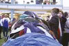 Volunteers and attendees of this year's Mat-Su Project Homeless Connect sift through mountains of free clothing donated for the event by the Turn-a-Leaf thrift store in Wasilla, Bishop's Atti