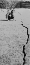 This photo courtesy of Nancy Bidwell show’s Bidwell’s father sticking his arm down a crack that opened up in the family’s backyard during the 9.2-magnitued Good Friday earthquake March 27, 19