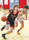 Wasilla's Barak Wagle drives past a defender against Grace Christian. Bruce Eggleston/matsusports.net