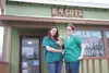 K-9 Cuts owners Tabitha Pedalino, left, Cyndi Polya and Pedalino’s dog Penny pose for a photo Friday in front of the new dog grooming business in Wasilla. The shop will be hosting a grand ope