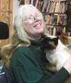 Vickie Cole's studio cat, a rescued Siamese named Tut, demands
attention. Photo by MARY SPEARS/Frontiersman.