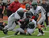Colony defenders stop Juneau-Douglas running back Manase Maake during Saturday's 48-0 Knights win over the Crimson Bears in Juneau. KLAS STOLPE | JUNEAU EMPIRE