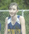 MATT TUNSETH/Frontiersman Susitna Valley cross country runner
Ashley Evans shows off a muddy — but happy — face shortly after
completing Saturday’s Palmer Invite.