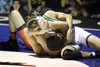 West's Chris Weidner tries to push away Colony sophomore Robert Haan just before Haan pins Weidner during the 160-pound final of the Lancer Smith Memorial at Palmer High School Nov. 22. Jerem