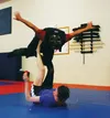 Self-defense instructor Mark Passmore put on the "bad guy suit" at the end of the class on Sunday, Aug. 10 so women could try out their new moves at full strength without hurting anyone. By C