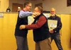 Outgoing Mat-Su Borough Assembly member Matthew Beck hugs Mat-Su Borough Mayor Vern Halter. Tim Rockey/Frontiersman