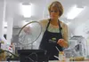 Nutrition educator Winona Benson of the Mat-Su Cooperative Extension Service lifts the lid on some lightly steamed collard greens at Good Shepherd Lutheran Church’s commercial kitchen in Wasi