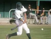 Mat-Su catcher Nick Croce drives a ball into the outfield during
the Miners’ 8-5 loss to the Anchorage Bucs on Wednesday. Croce led
Mat-Su with two hits and two RBI. JEREMIAH BARTZ/Frontiersm