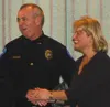 Wasilla Police Chief Don Savage accepts the Greater Wasilla
Chamber of Commerce Citizen of the Year award from Cheryl Metiva.
Photo by JOEL DAVIDSON/Frontiersman.