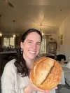 Delaney Peters, owner and baker at Delaney’s Sourdough microbakery, shows off one of her signature loaves. The local home-based operation will be taking orders for Christmas beginning Dec. 14
