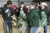 A giant cabbage is carried across the arena after being weighed
at the 2011 Alaska State Fair Giant Cabbage Weigh Off Friday
evening. Steve Hubacek took this years contest with a 126.4 lb
hea