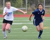 Palmer's Ruby Wright (left) and Soldotna's Meijan Leaf battle for the ball Thursday, May 23, 2019, at the Div. II state soccer championships in Eagle River. Joey Klecka/Peninsula Clarion