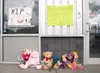 A memorial of stuffed animals, flowers and signs for 19-month-old Faith Phillips are left outside Illuminations Child Care and Educational Center in Wasilla. The Wasilla Police Department has