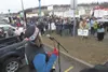 Mat-Su Education Association president Jill Showman speaks to
the crowd gathered during a rally Monday afternoon in Wasilla.
(ROBERT DeBERRY/Frontiersman)
