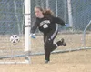 (JEREMIAH BARTZ/Frontiersman) Houston goalkeeper Jen Gardner
knocks a shot away from the Houston goal during a 3-0 loss to the
Homer Mariners on Friday at Houston High School.
