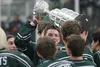 LEFT: Members of the Colony Knights hoist the Sudzy Salmon Challenge Cup following a 6-1 win over Palmer Friday.BELOW: Colony’s Kaden Ketchum moves the puck up the ice during a win over Palme