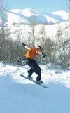 Dustin Murr, 17, rides 16-Mile in Hatcher Pass while on spring
break this week. Tuesday afternoon, skiers and snowboarders
described the trails as a bit icy but the weather as superb. Photo
b