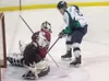 Alaska Avalanche forward Zach Smith puts the puck in the net
during the second period of Friday's game against the Fairbanks Ice
Dogs at the Palmer Ice Arena. (ROBERT DeBERRY/Frontiersman)