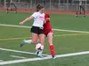 Wasilla junior Kaitlyn Phillips gets in front of a West Valley player during a 2-0 win over the Wolfpack April 20, 2018. JEREMIAH BARTZ/ Frontiersman