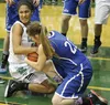 Colony's Chase Stephens tries to wrestle the ball away from Palmer's Kaylee King during a win over the Moose Jan. 13. JEREMIAH BARTZ/Frontiersman