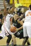 Colony junior Ashley Turcotte goes through a pair of defenders during an overtime win over West Anchorage in the state semifinals Friday in Anchorage. Colony moved into the state title game w