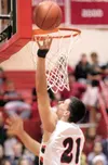 ROBERT DeBERRY/Frontiersman file photo Wasilla senior Cody
Pfeifer goes up for two points during a game against the Palmer
Moose at Wasilla High School.