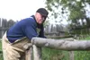 Werner Schuster checks on his animals June 16, 2011, after Alaska State Troopers, officers from the state Department of Fish and Game and state biologists descended on Wolf Country USA to run