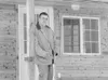 Nuchek Structures CEO Dan Brown stands on the front porch of the
Journeyman Model do-it-yourself cabin kit at his Meadow Lakes
facility. (ROBERT DeBERRY/Frontiersman) Robert DeBerry