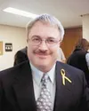 Judge Greg L. Heath was installed into the Palmer District court
during a ceremony Friday afternoon. The yellow ribbon he wears is
in recognition of his son-in-law, currently serving in Baghd