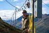 U.S. Air Force Airman 1st Class William Dickerson, an exterior electrician assigned to 773d Civil Engineer Squadron, performs maintenance work on the star at Mount Gordon Lyon, Alaska, Aug. 3