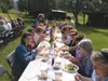 Participants in the 2013 Alaska Farm Bureau Mat-Su farm tour sample locally-grown food during a lunch stop. Courtesy Alaska Farm Tours