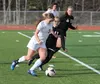 Wasilla's Ally Hull works her way past the defense during a 6-1 win over Colony April 14 at Wasilla High. JEREMIAH BARTZ/Frontiersman