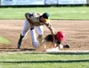 Peninsula Oilers first baseman John Hanley beats the tag of Mat-Su Miners first baseman Nick Cirelli during Mat-Su’s 5-2 win over the Oilers Monday, June 14, 2021, at Hermon Brothers Field in