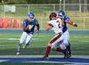 Palmer’s Lavar Marshall follows a lead block during a 37-15 win over Dimond Aug. 24 at Palmer High School. Tim Rockey/Frontiersman