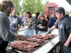 Dan Pollock, left, and son Gareth grill hot dogs for the hungry
Palmer Pride crowd. Dan was named Palmer Citizen of the Year later
Friday evening. Photo by STEVE KADEL/Frontiersman.