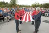 Members of the Palmer Elks Lodge conduct a flag folding ceremony during Thursday's Flag Day event at the Curtis D. Menard Memorial Sports Center in Wasilla. ROBERT DeBERRY/Frontiersman.com