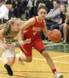 Wasilla's Olivia Davies works her way past Colony's Abby Kenley toward the baseline during a winover the Knights Tuesday, Jan. 30, 2018. Courtesy of Bruce Eggleston/matsusports.net