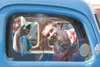 Wasilla High School freshmen K.C. Jefferson and Jacob Blomker check out the interior of a restored Ford pickup truck during the 15th annual Wasilla High School Car Club Car Show Friday mornin